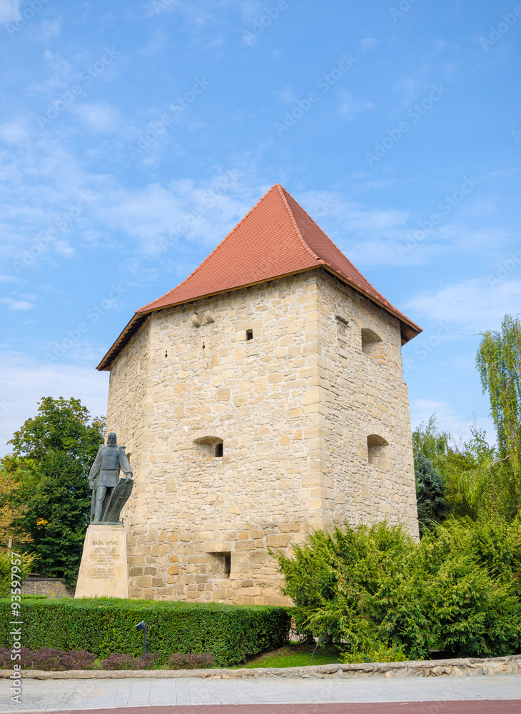 Tailors' Bastion in Cluj Napoca city, Transylvania region of Romania. A medieval defence tower with the statue of national hero General Baba Novac in the front