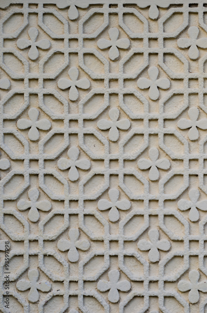 Floral and geometric stucco work on an exterior wall in romania with a lot of detail on white plaster