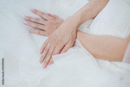 Hand of bride with wedding ring. 