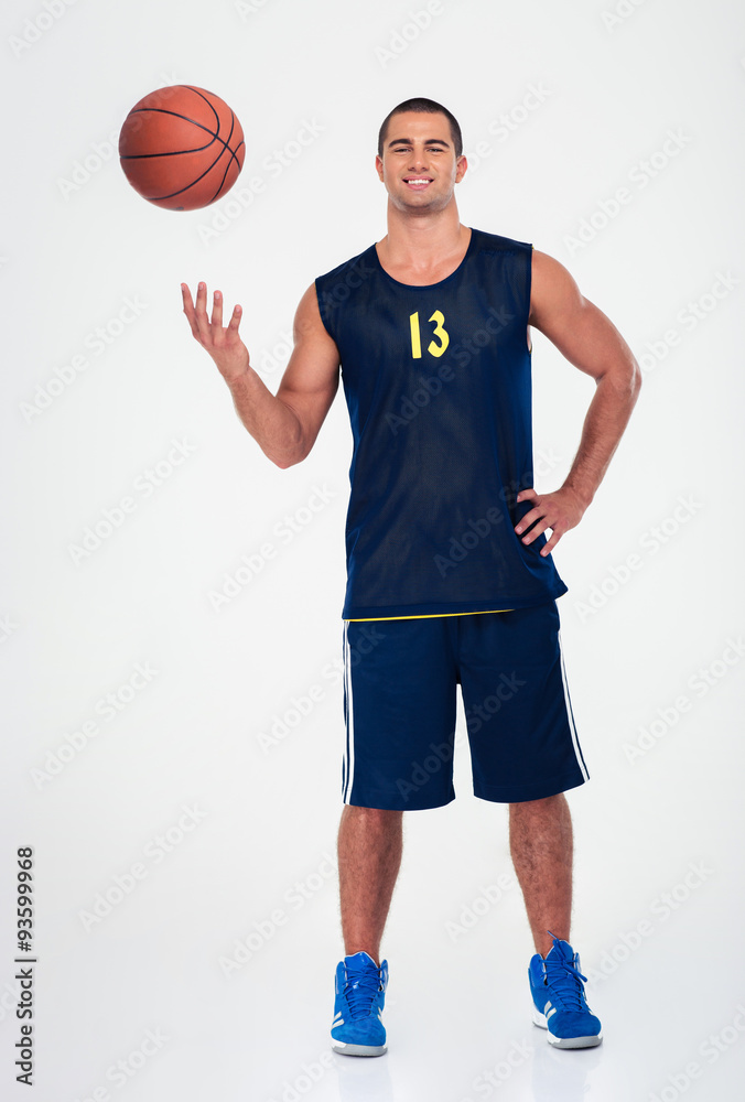 Full length portrait of a smiling basketball player