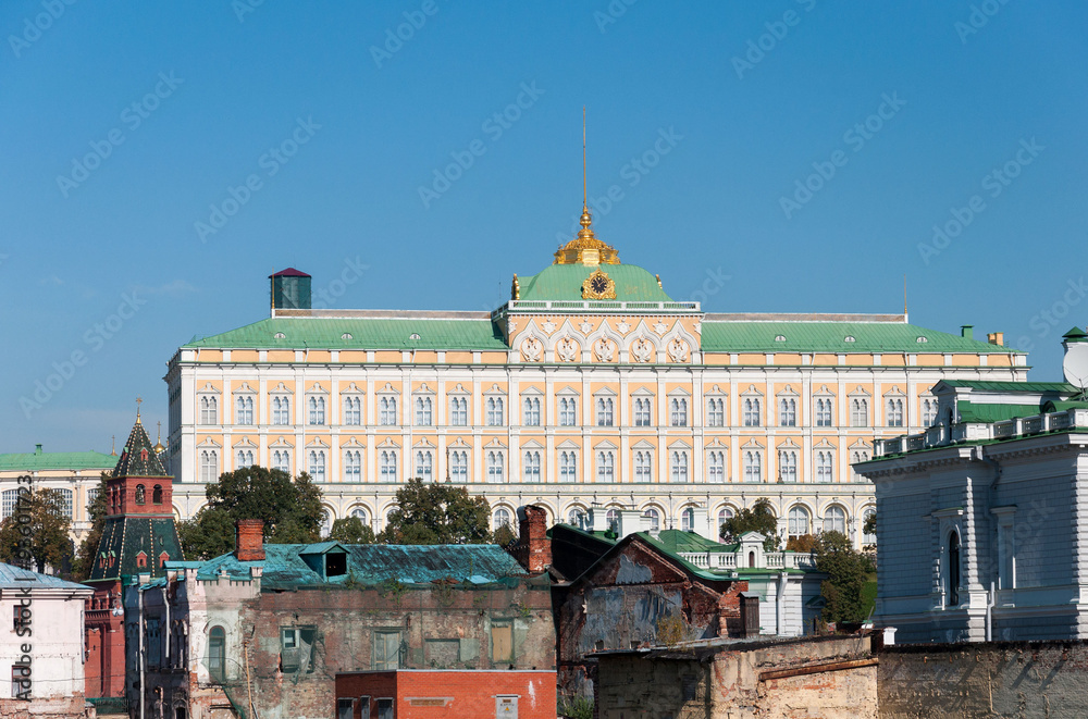 Naklejka premium Grand Kremlin Palace on the background of old ruined houses.