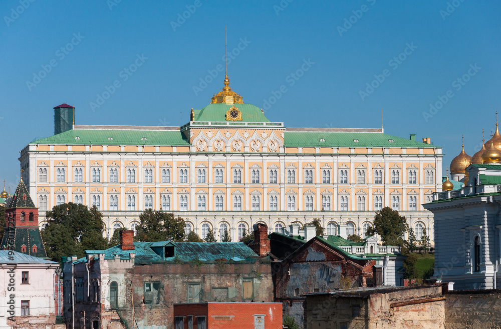 Naklejka premium Grand Kremlin Palace on the background of old ruined houses. 