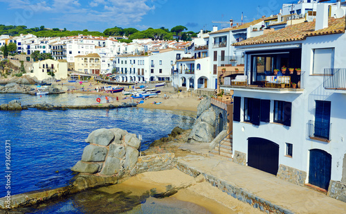 White houses on seaside. Coastal town Calella de Palafrugell on photo
