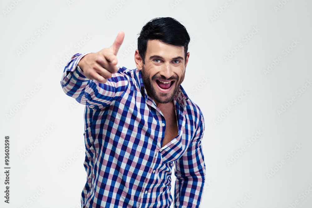 Angry man showing gun gesture with fingers at camera Angry man showing gun gesture with fingers at camera