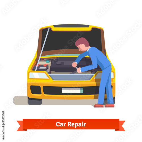 Car mechanic repairs engine at car service station