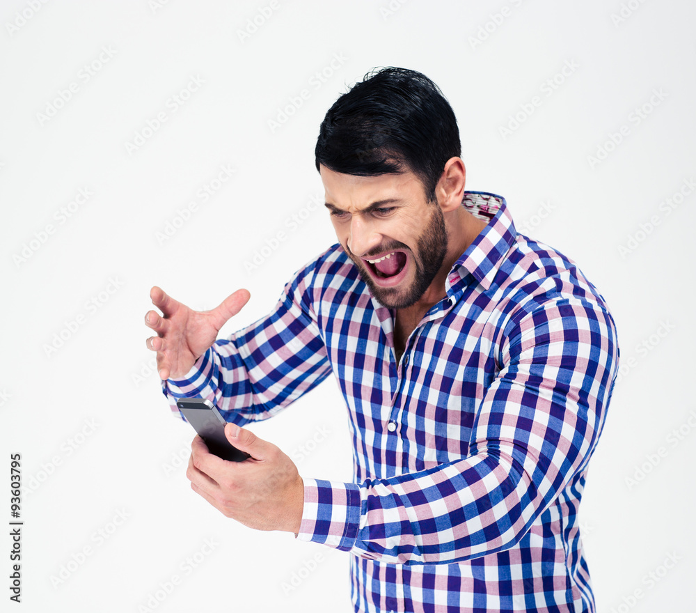 Portrait of angry man shouting on smartphone Portrait of angry man shouting on smartphone