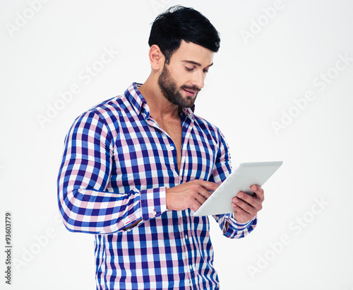 Portrait of a young man using tablet computer