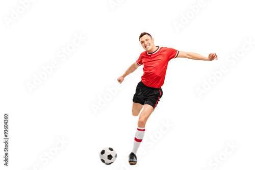 Young football player kicking a ball © Ljupco Smokovski