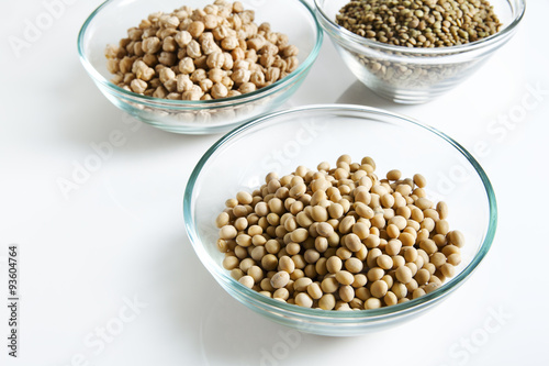 Soybeans in bowl and other Legumes on white