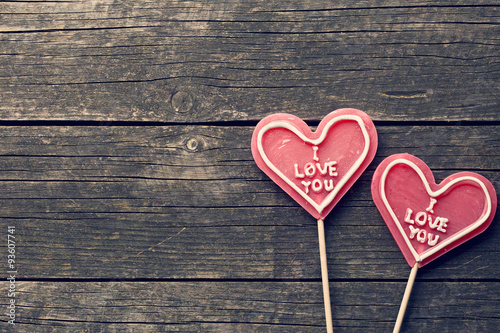 Lollipop heart on vintage wooden background