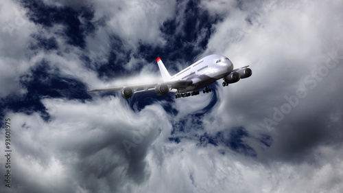 Verkehrsflugzeug durchquert eine Wolkenfront photo