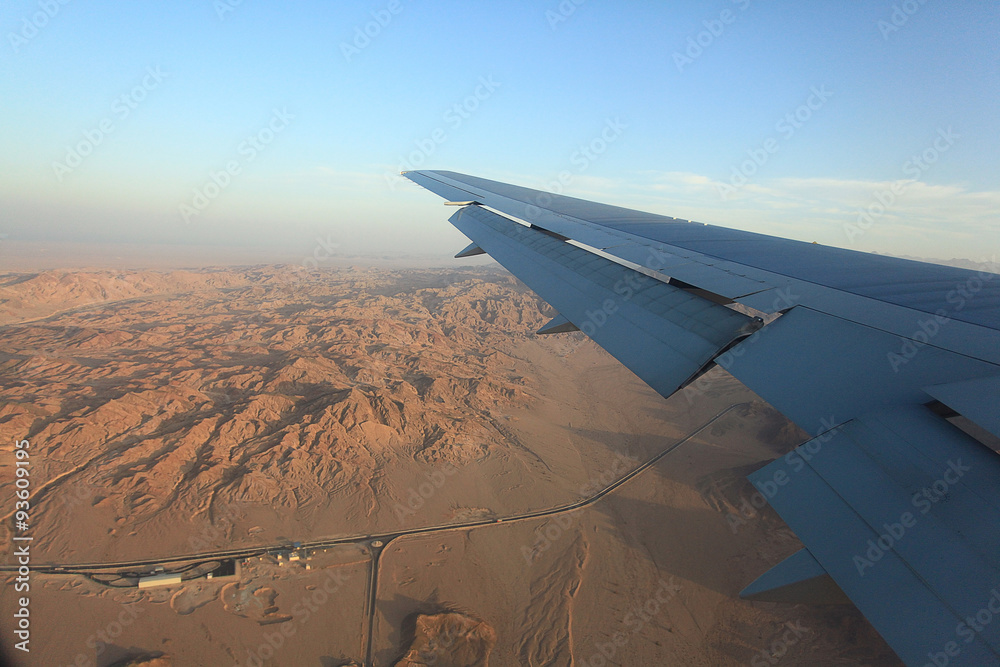 view from the airplane desert mountains