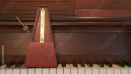 Classic metronome on a piano keys, audio included, 4K, Ultra HD