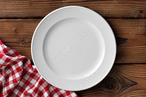 Fototapeta white dish on wooden table