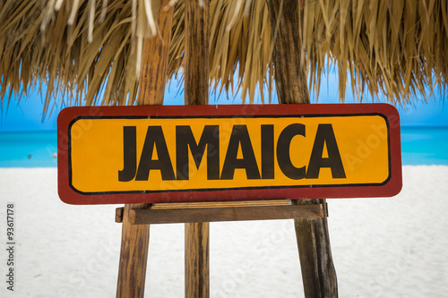 Jamaica sign with beach background photo