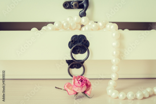 White pearls necklace in wooden casket