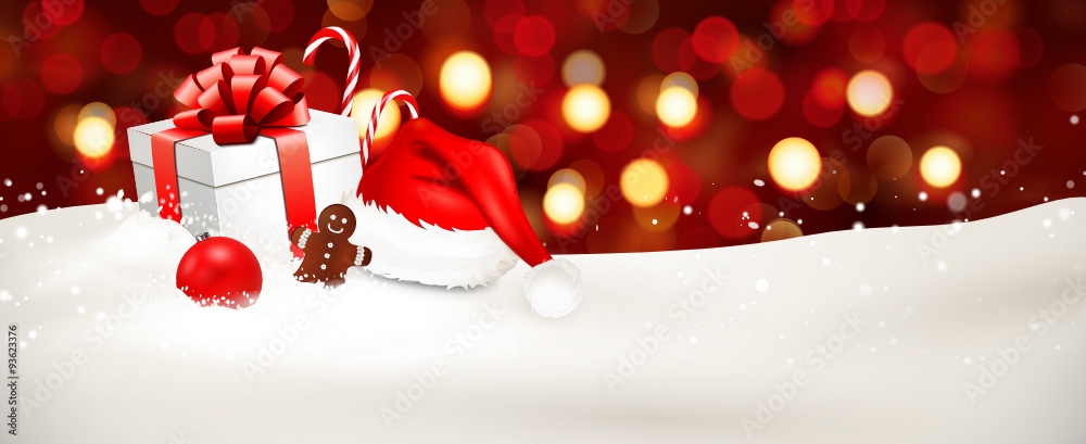 Weihnachtsgeschenke im Schnee mit Bokeh Hintergrund