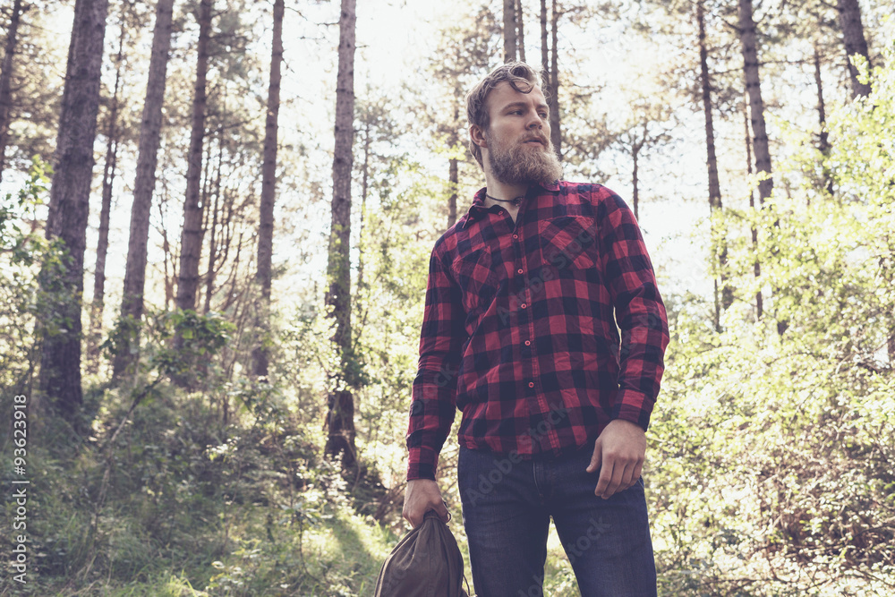 Hiker with beard in forest. Hiker with beard in forest.