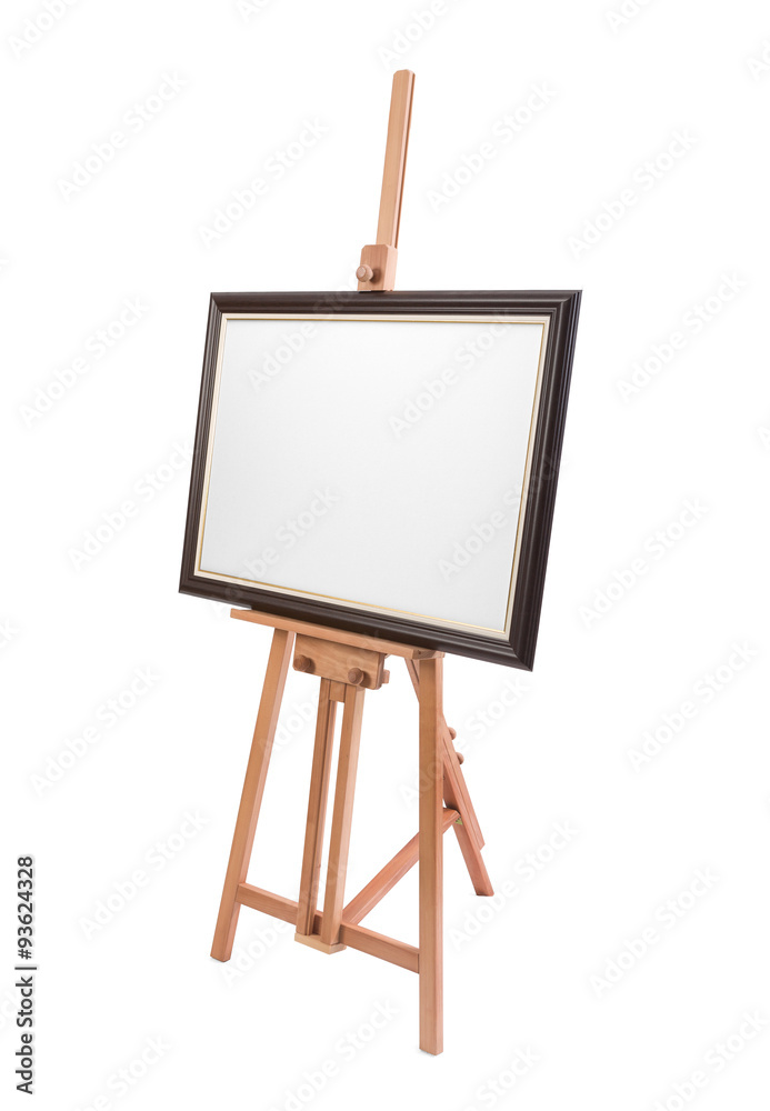White painter canvas in frame on wooden easel isolated on white White painter canvas in frame on wooden easel isolated on white