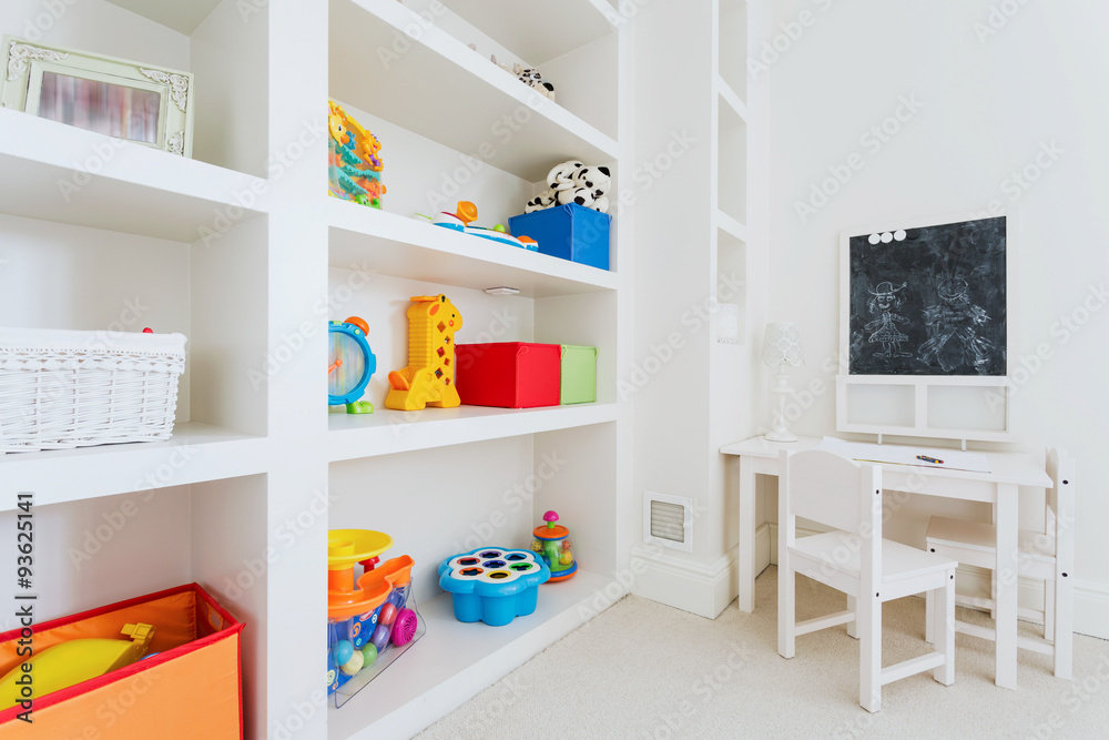 Fototapeta premium White furnitures in child room