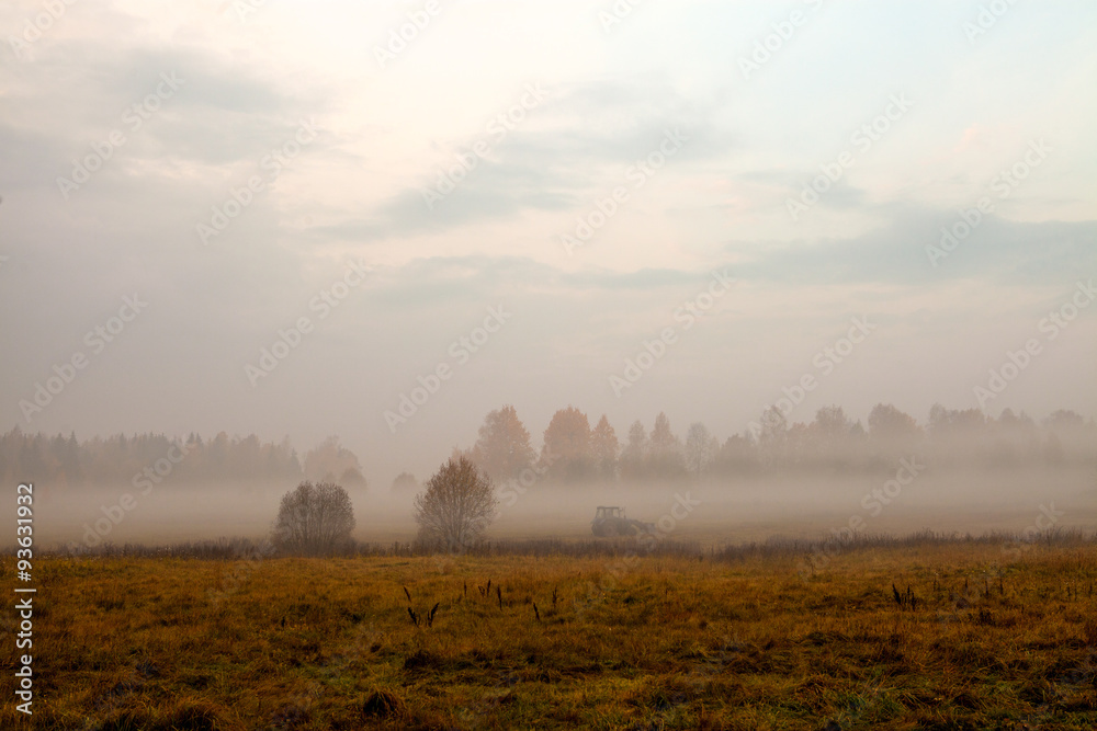 Fototapeta premium Tractor in fog