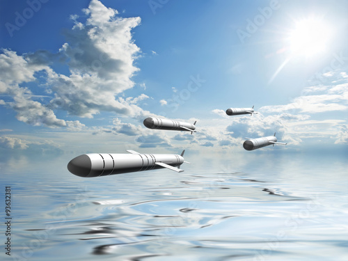 Cruise missiles flying against the clouds