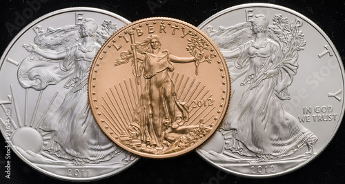 US Gold Eagle on 2 US Silver Eagles w/ Black background photo