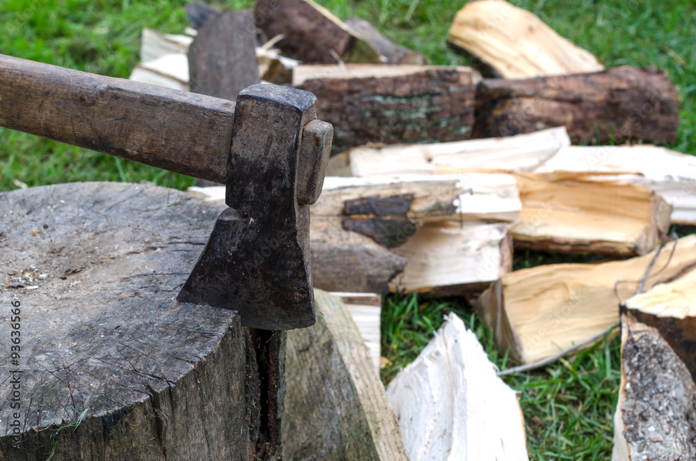 Chopping firewood with an axe Stock Photo | Adobe Stock