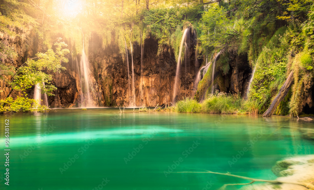 Waterfall with sun at Plitvice Lakes National Park, Croatia Waterfall with sun at Plitvice Lakes National Park, Croatia