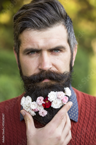 Man with flowers on beard