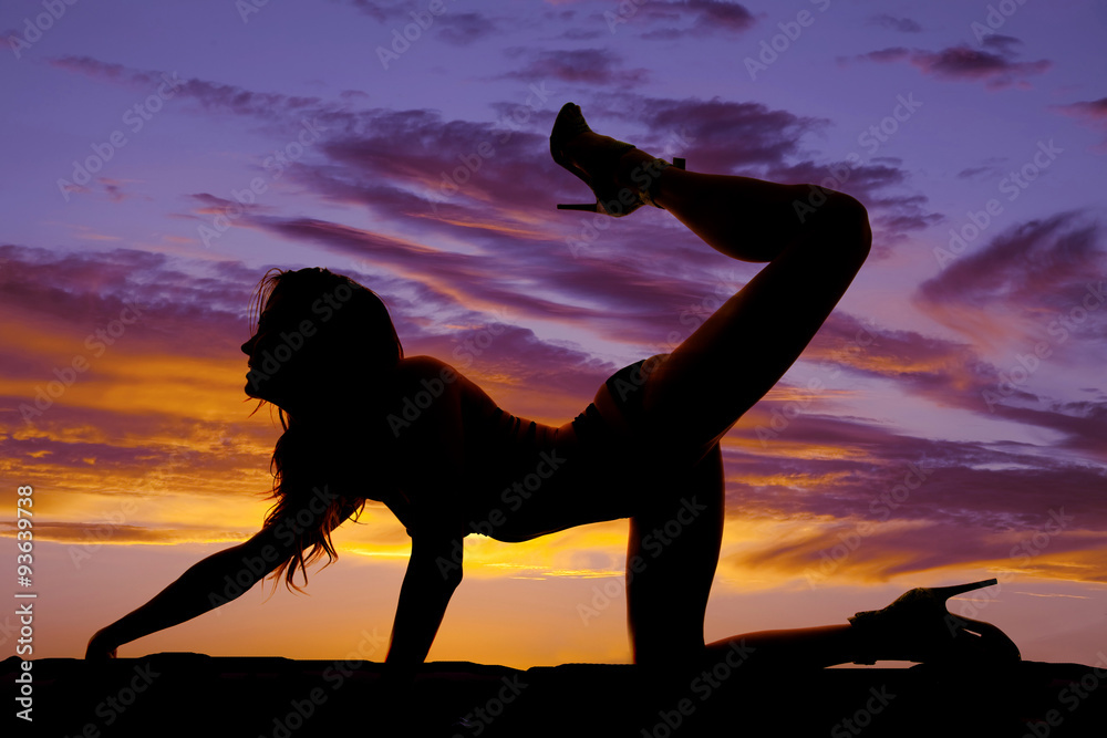 silhouette woman in bikini knee with leg and head up