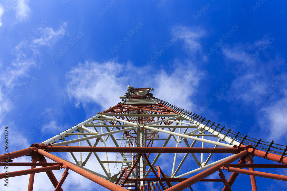 bottom view of a telecommunications tower. red and white telecommunication tower against blue sky, bottom view bottom view of a telecommunications tower. red and white telecommunication tower against blue sky, bottom view