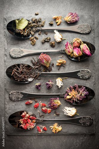 Different types of tea and dried herbs. Vertical