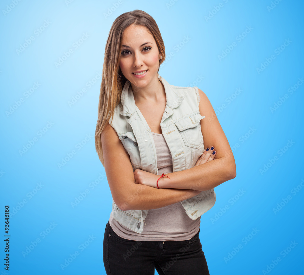 Portrait of young woman standing with arms crossed Portrait of young woman standing with arms crossed