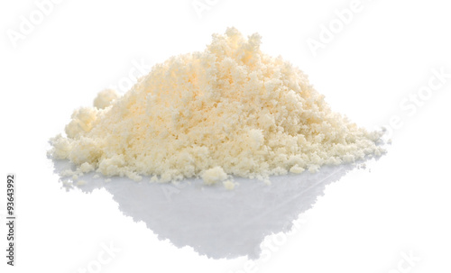 Grated cheese over white background