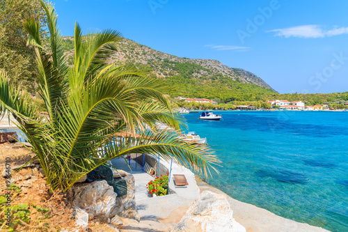 Palm tree and beautiful coast of Samos island at Posidonio bay, Greece