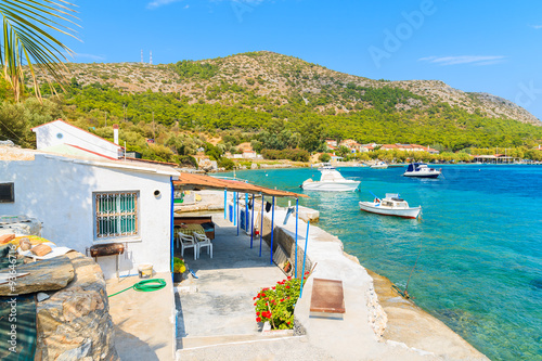 Fishing village buildings on beautiful coast of Samos island at Posidonio bay, Greece