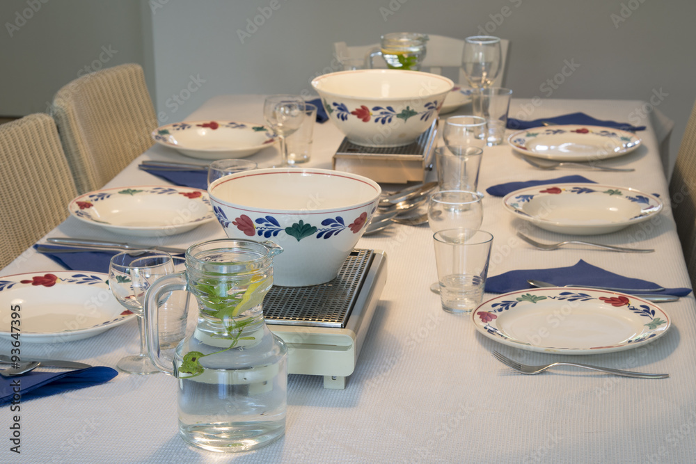 Table for dinner with plates and bowls