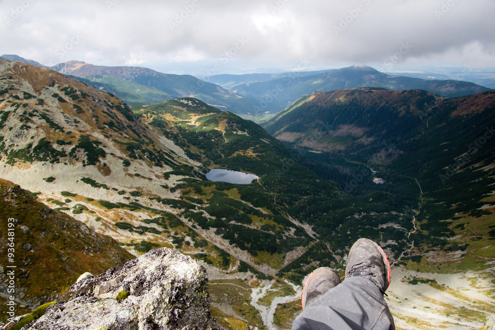 man looking from Ostry Rohac peak
