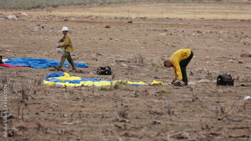 Parachute smoke jumpers after landing at fire location P HD 1549 Parachute smoke jumpers after landing at fire location P HD 1549