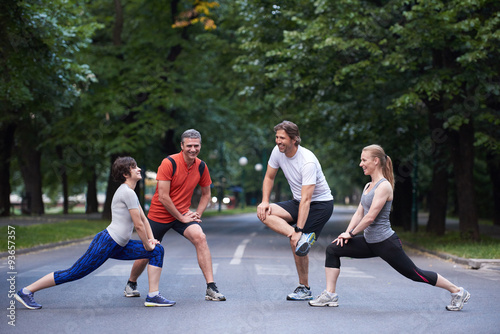 jogging people group stretching