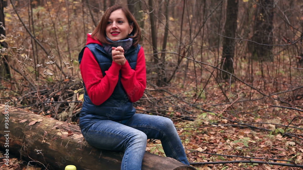 The girl is warming up in the autumn forest The girl is warming up in the autumn forest