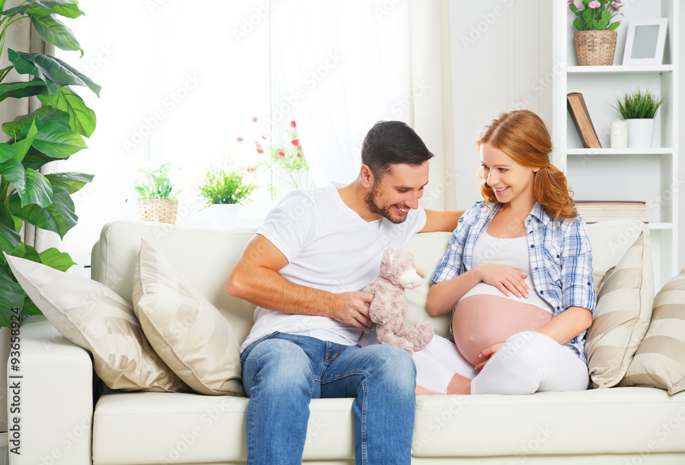Obraz premium happy family in anticipation of the birth of baby. Pregnant woma