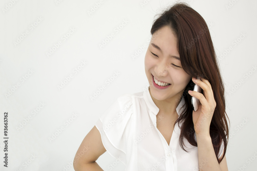 Smiling young asian businesswoman speaking on smart phone Smiling young asian businesswoman speaking on smart phone