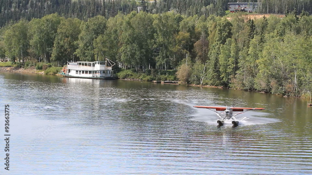 Float plane landing by river boat fairbanks Alaska P HD 1473