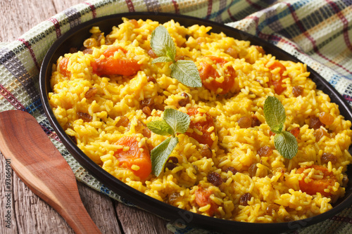 Vegetarian pilaf with saffron and dried fruit close up. horizontal
