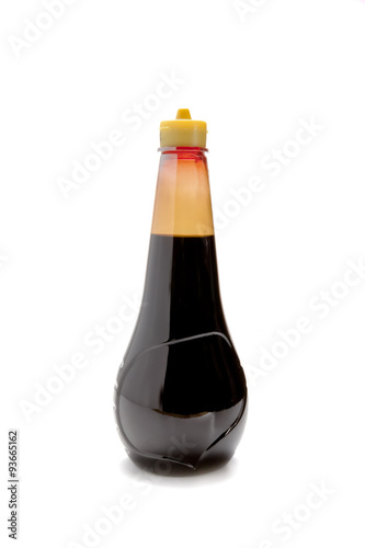 Bottle of soy sauce on background