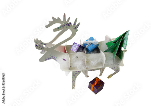 Christmas decoration reindeer with gifts on a white background photo