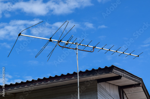 television antennas with a cloudy sky background