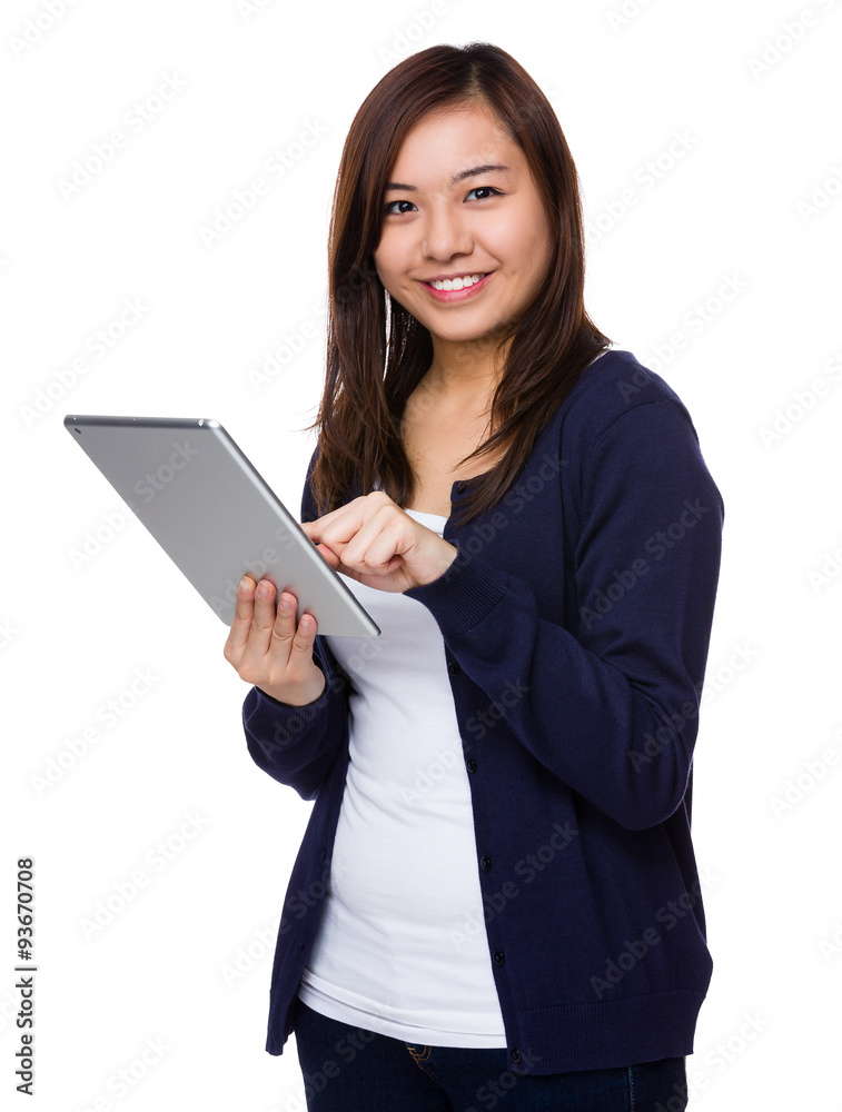 Asian woman use of the tablet pc Asian woman use of the tablet pc